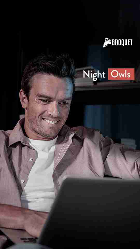 Man using his laptop at night, broquet logo, text reads: Night Owls
