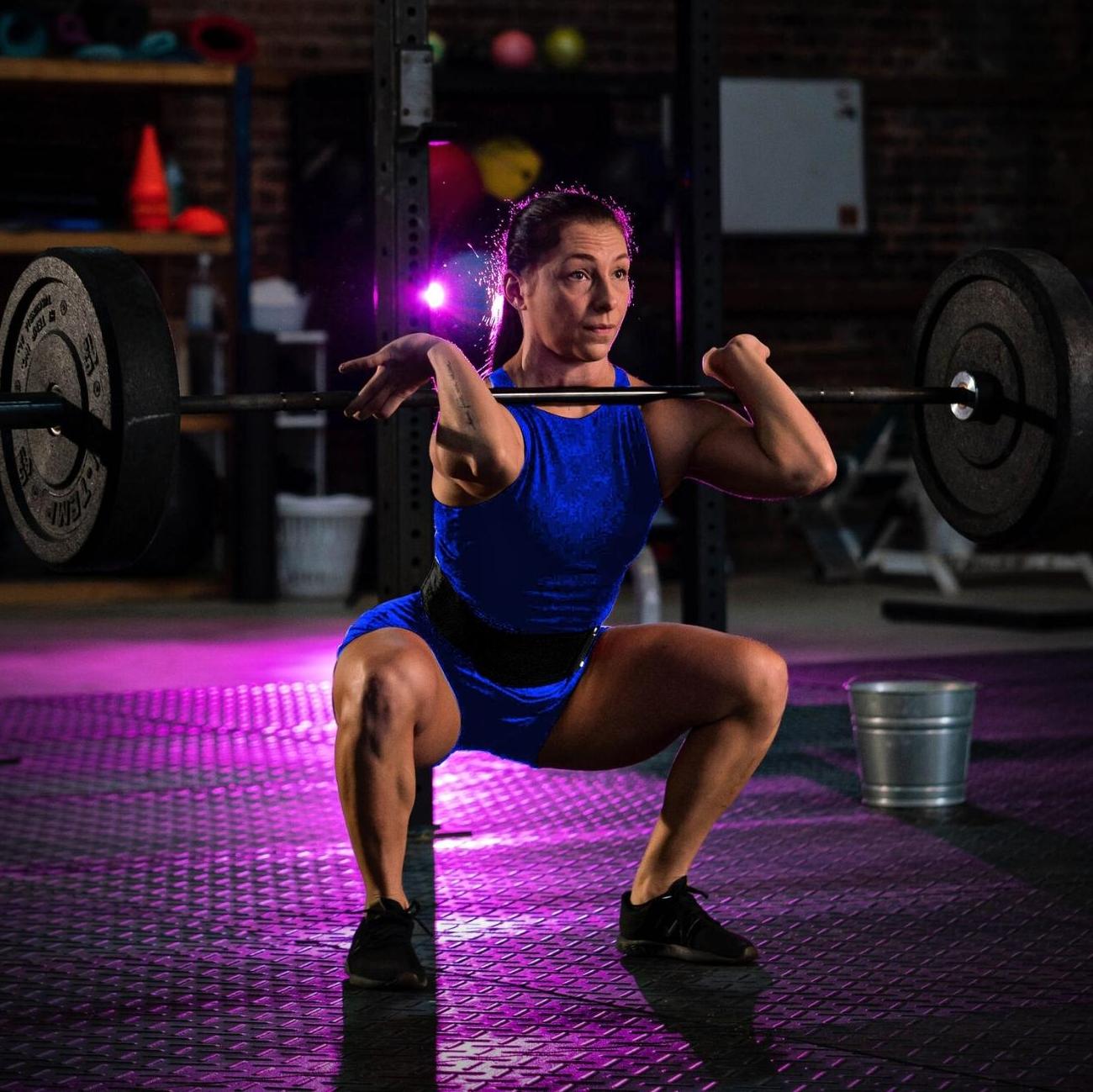 Closeup of man wearing lever weightlifting belt in black