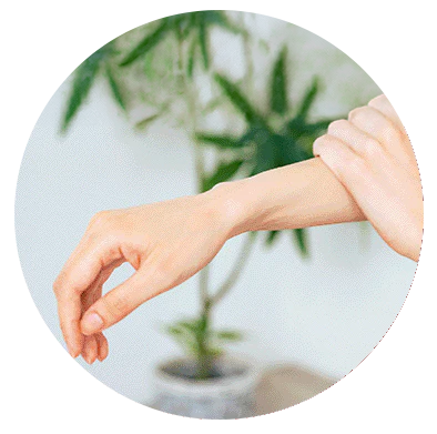 An aesthetic composition of a woman massaging her hands surrounded by floral artwork