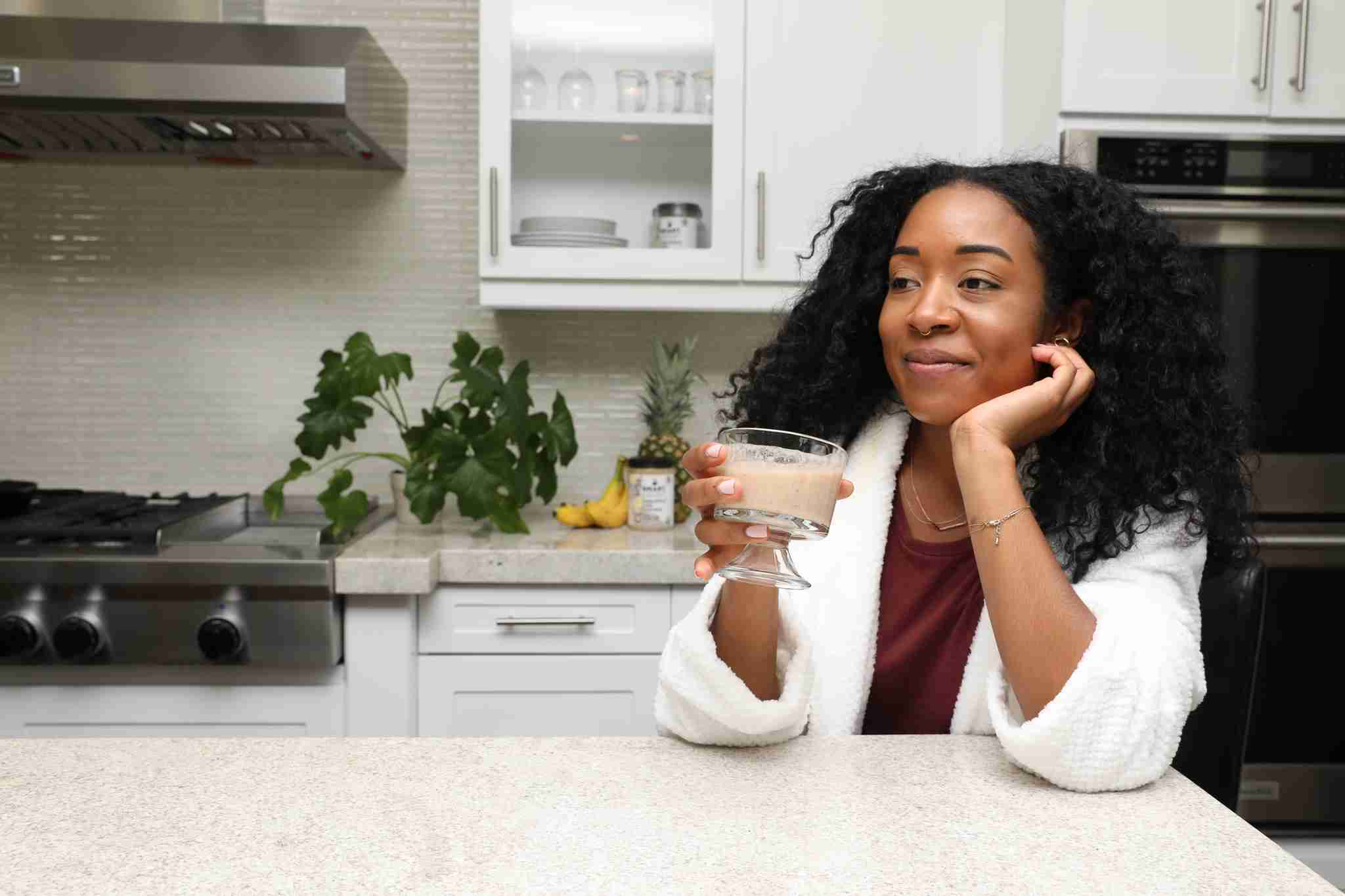Woman drinking a glass of Smart Pressed Juice