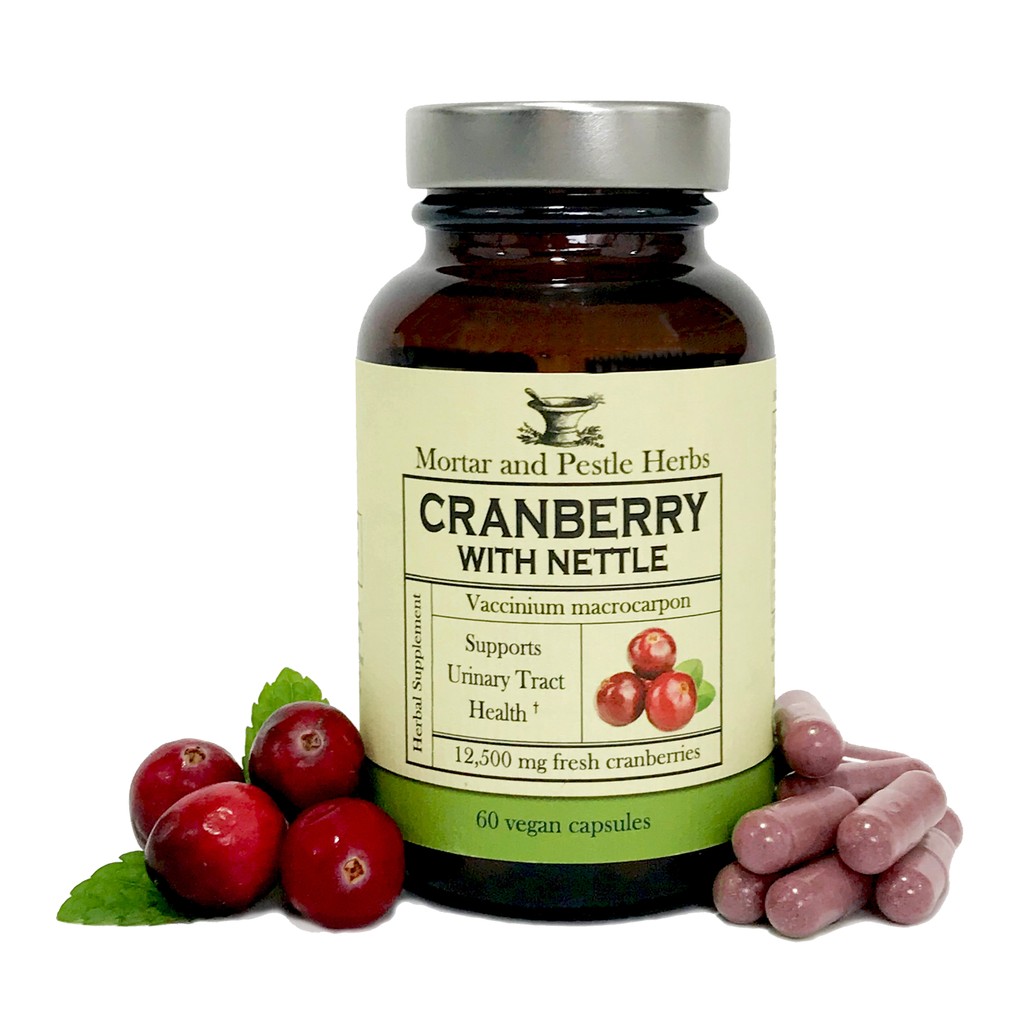 Herbal Roots Cranberry bottle with capsules, cranberries and nettle leaves