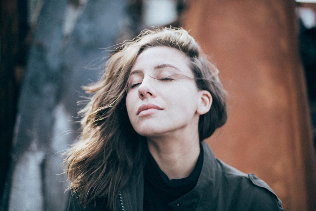 Woman taking a deep breath