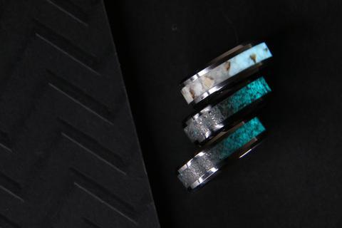 Three custom meteorite engagement rings.