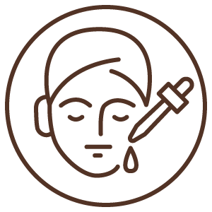 A face being treated with a serum dropper.