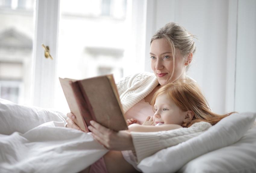 Mom reading to daughter