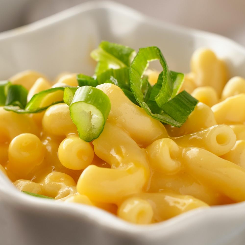 macaroni and cheese in dish with scallions