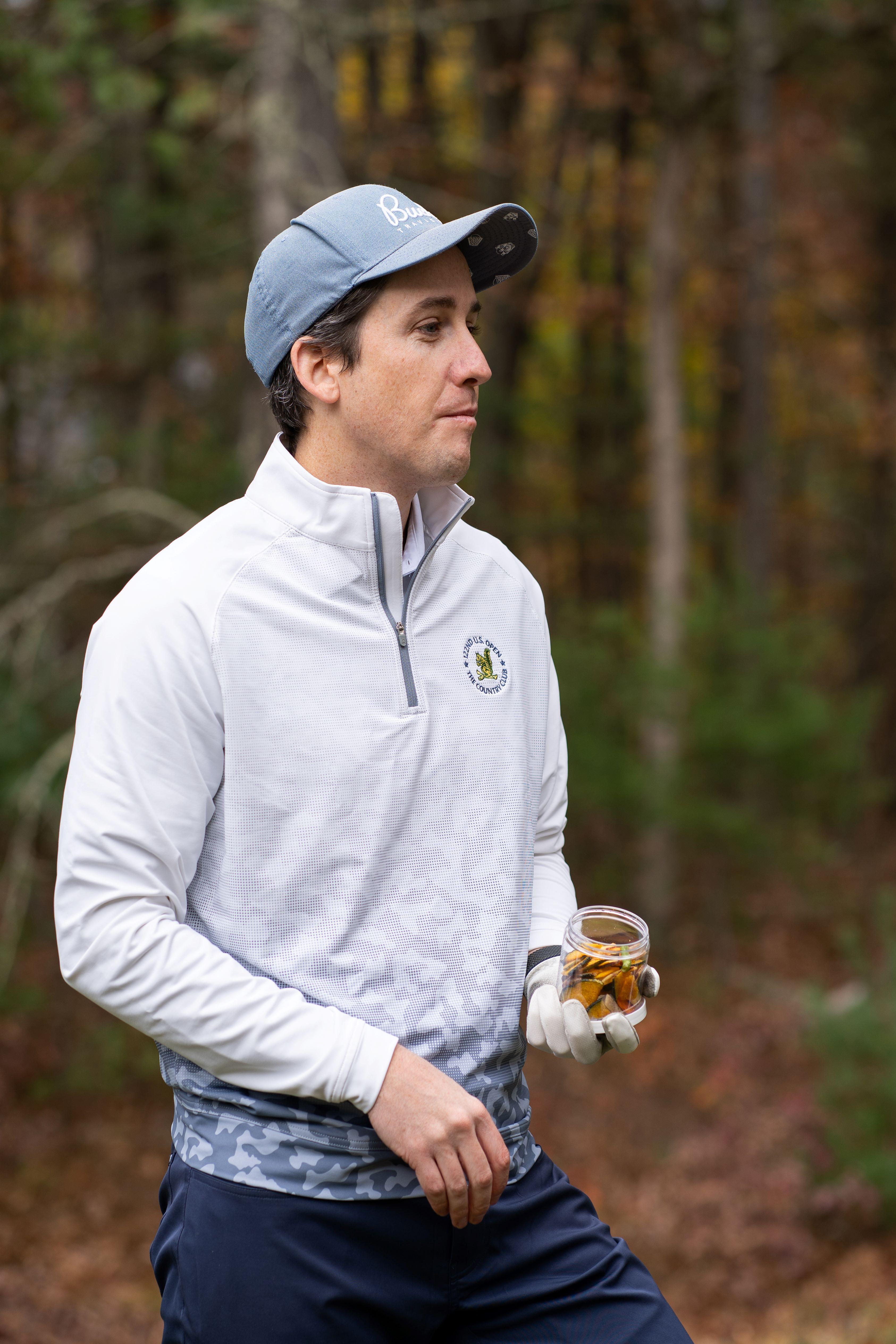 Golfer eating nutritious snack on the course