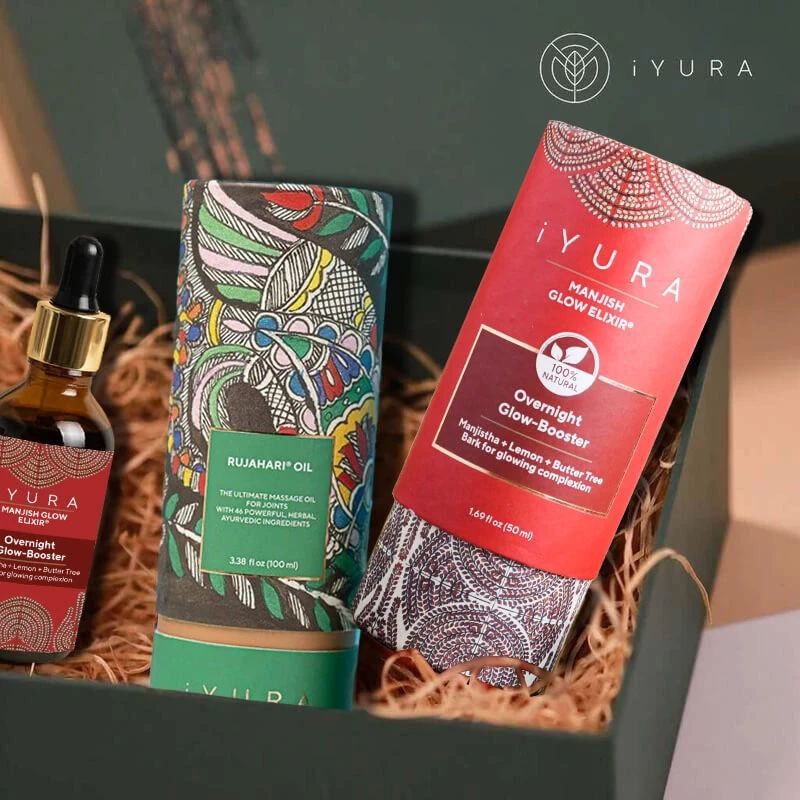 Manjish Glow Elixir and other iYURA products showing off their beautiful packaging with Madhubani painting