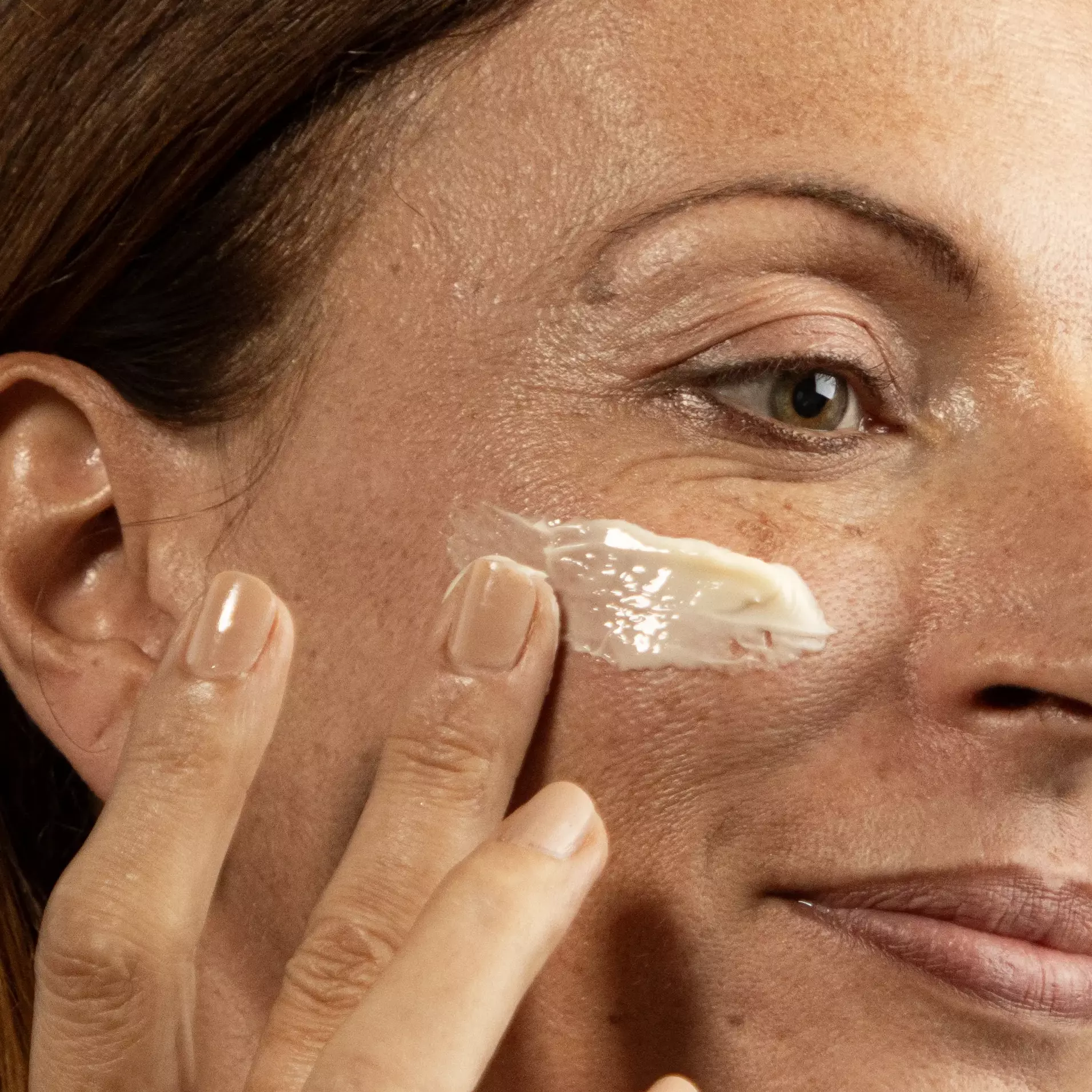 Women applying Blavana Face Pommade cream theayurvedaexperience