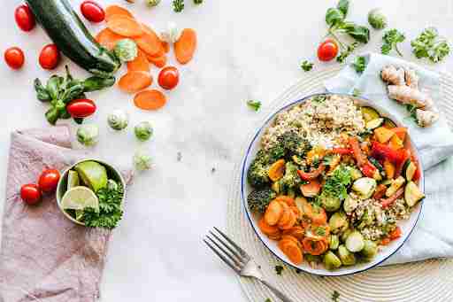 vegetables cucumber tomato quinoa broccoli carrots healthy meal cilantro