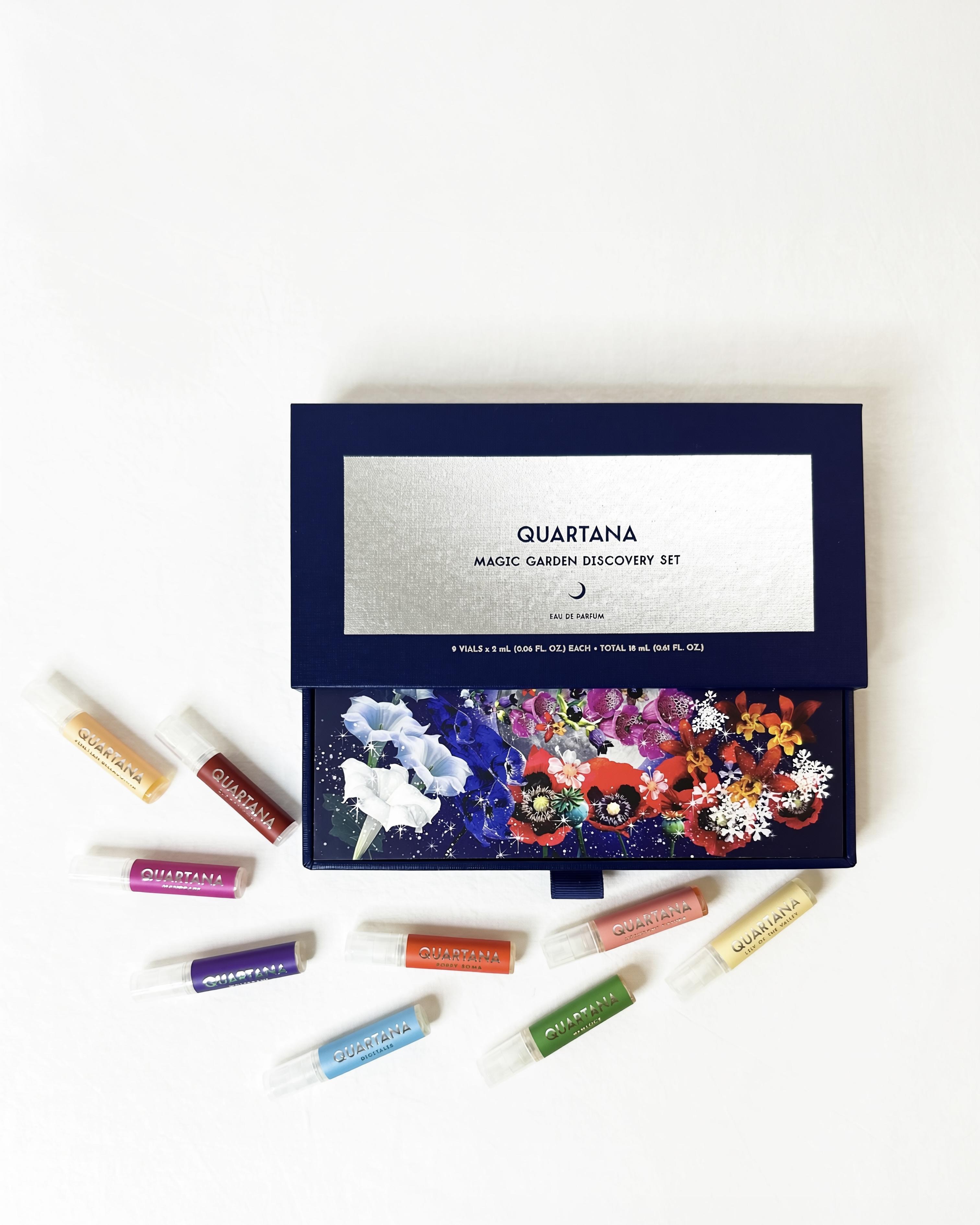 The Magic Garden boxed discovery set with its nine colorful perfume sprayers in 2mL arranged on a white background.