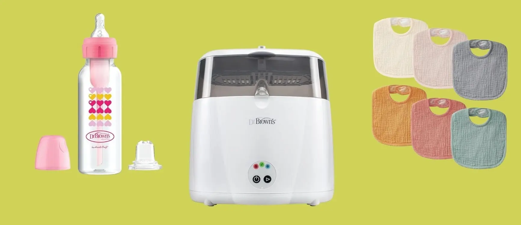 Dr. Brown’s baby feeding and care products displayed on a yellow background including a pink anti colic baby bottle with heart designs, a white electric sterilizer, and a set of soft textured bibs in neutral and pastel colors.