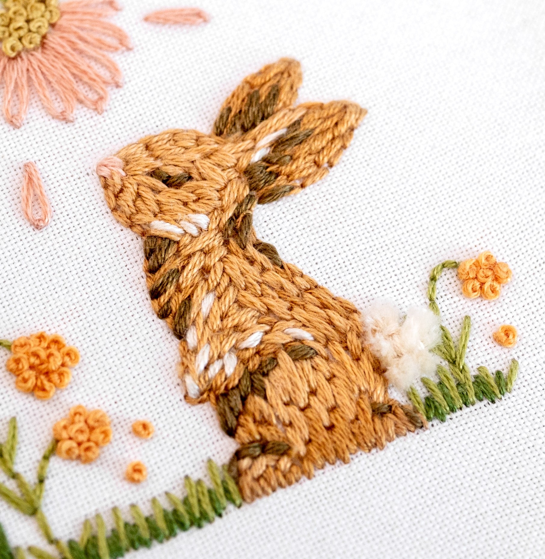 This is an image of a bunny from the modified Bunny Blooms Clever Poppy pattern stitched with Long and Short Stitch.