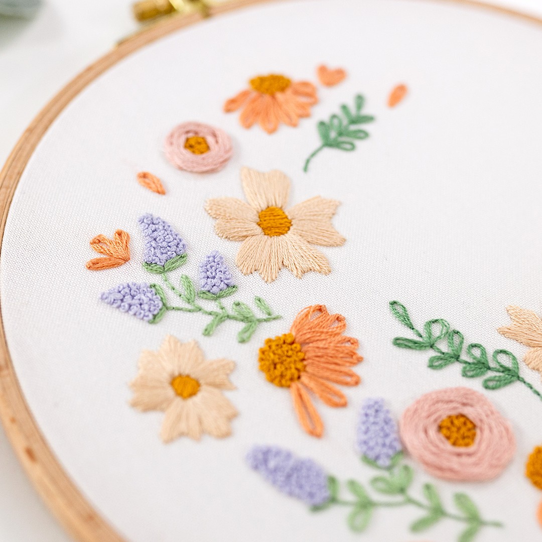 This is an image of satin stitch making up the leaves in the pattern, Blooming Lovely.