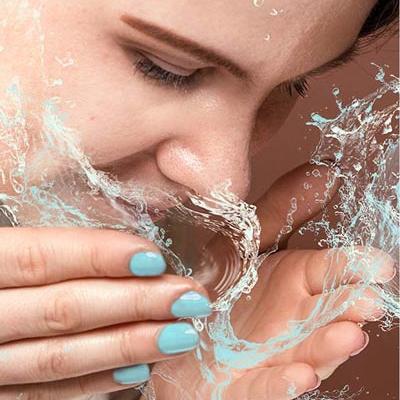 Splashing face with water
