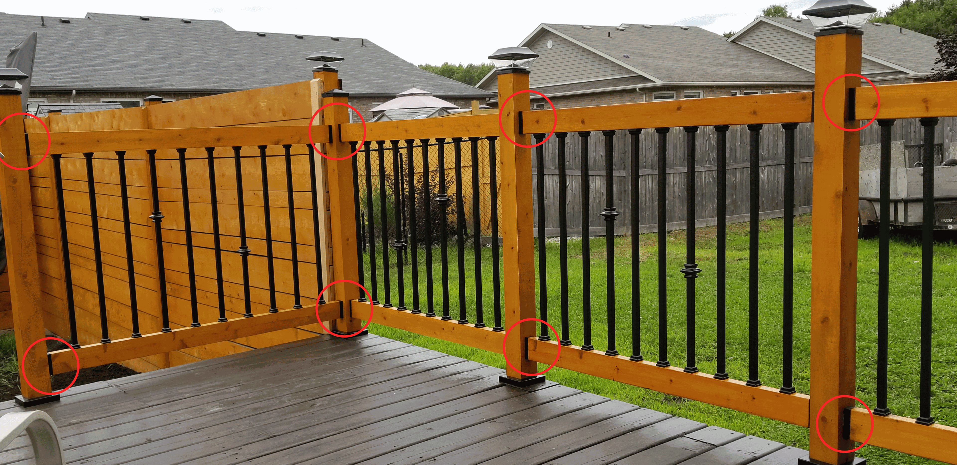 A row of deck support posts held up by deck foot anchors