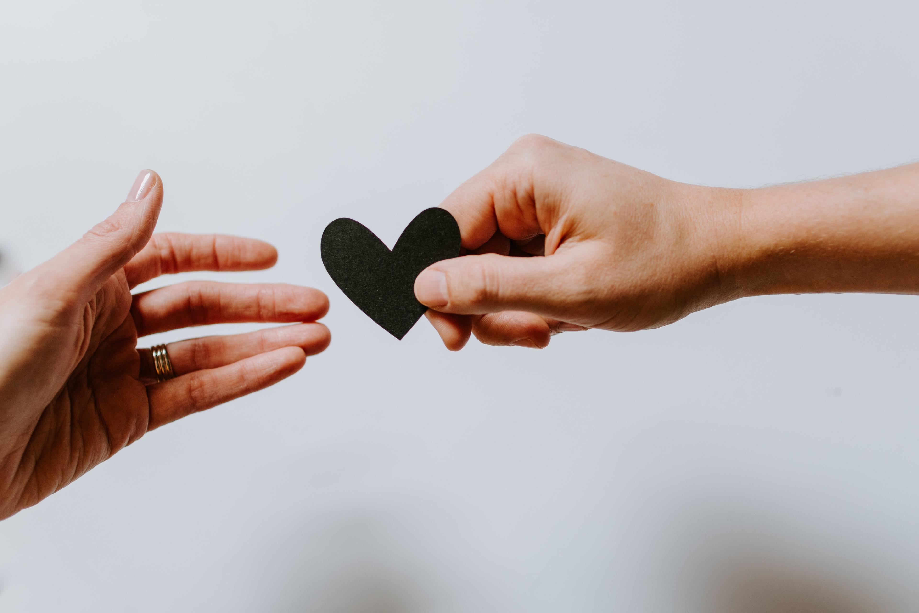 woman with hand over her heart