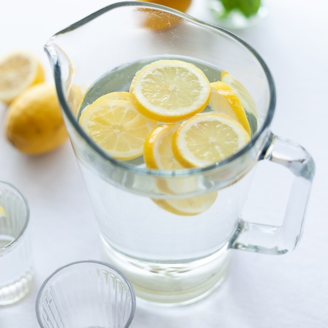 jug of water with lemons