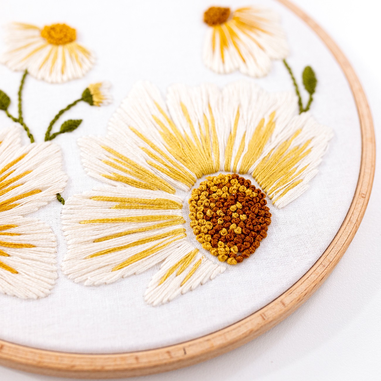 This is an image of the Daisy Blooms Modern Embroidery Pattern, available for purchase from the Clever Poppy Shop.