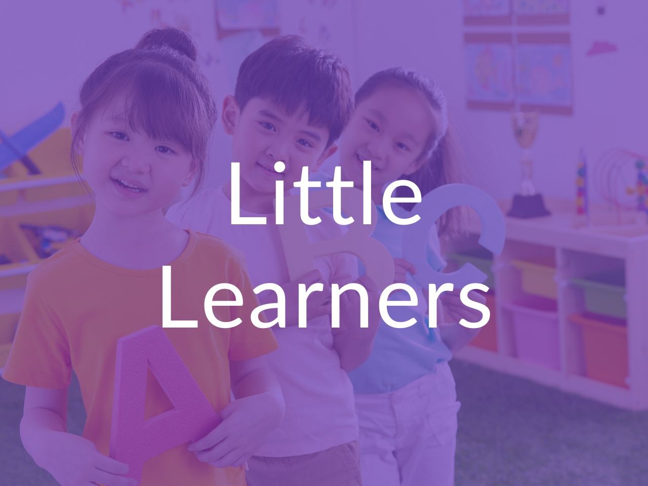 Pre k - Kindergarten program with 3 small children holding the alphabet