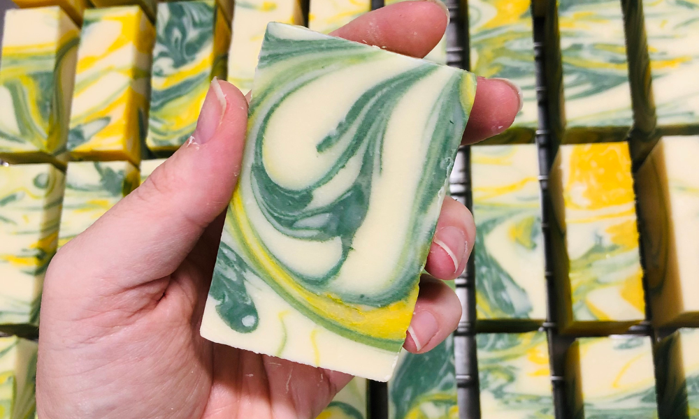 Holding a bar of Moon Haven Scent of Margaret River Soap