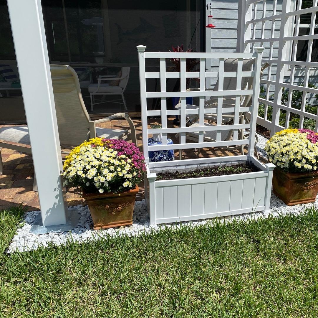 Flower bed pergola on top of deck foot anchor