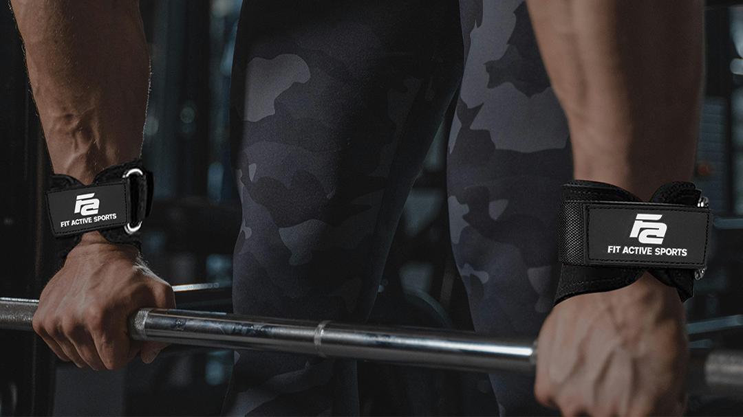 Woman squatting with a barbell wearing Fit Active Sports grey lever belt in a gym