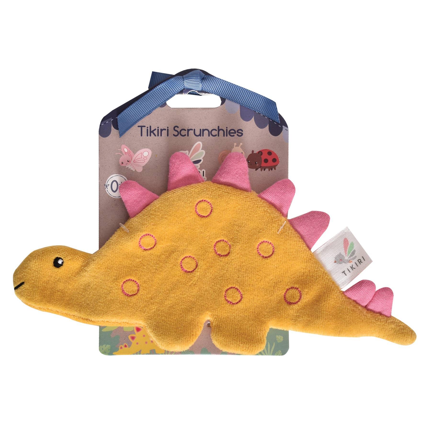Baby sleeping with pink octopus toy