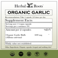 Herbal Roots Organic Garlic supplement facts label with serving size as 2 vegan capsules, 30 servings per container. Amount per 2 capsules is 600 mg of organic garlic. Other ingredients: Organic capsules (vegan) and nothing else! There are a USDA Organic, GMP certified, family owned business, vegan and tree free paper badges.