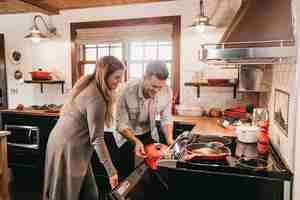 couple cooking and meal prepping in kitchen