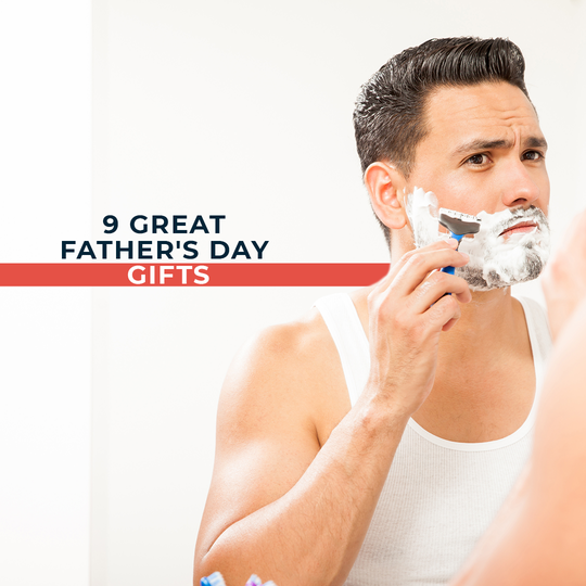 man shaving facial hair in front of a mirror