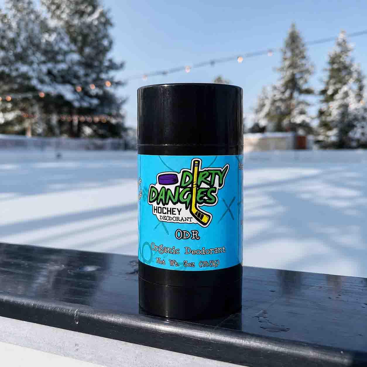aluminum-free deodorant ODR scent on the boards of an outdoor ice rink