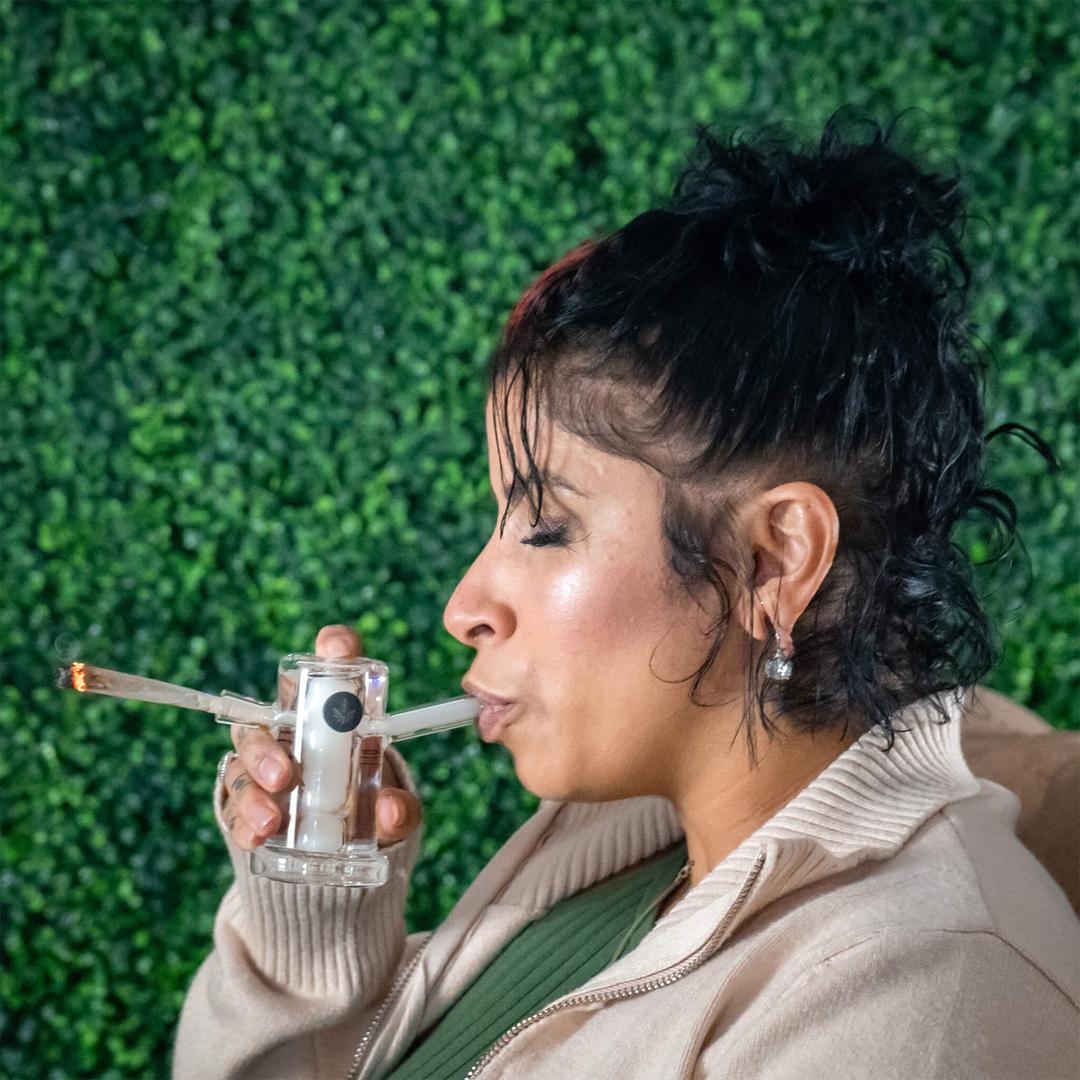 woman smoking a joint and blunt bubbler