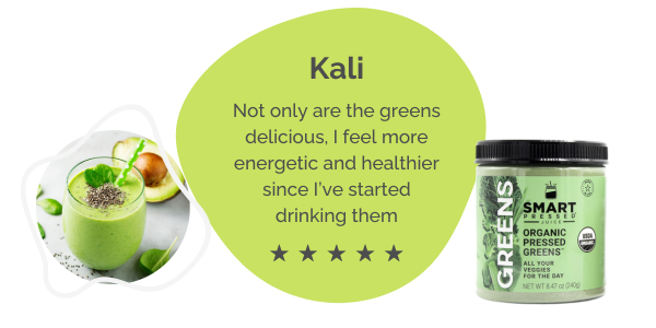 A 5-star review from Kali saying “Not only are the greens delicious, I feel more energetic and healthier since I’ve started drinking them” set on an irregular green circle. On the left side is a glass of green smoothie with a dash of chia seeds on top, a pair of mint leaves and a green twisty straw. Behind the glass is a slice of avocado. On the right side is one bag of Organic Pressed Greens.