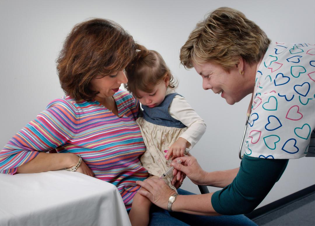 Nurse smiling at a kid