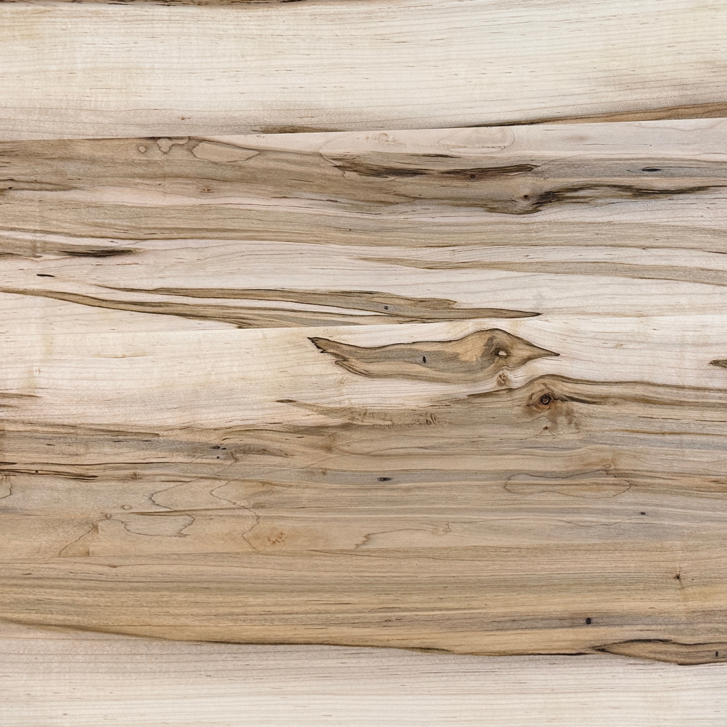 Ambrosia maple hardwood with natural streaking and character used for decorative serving boards