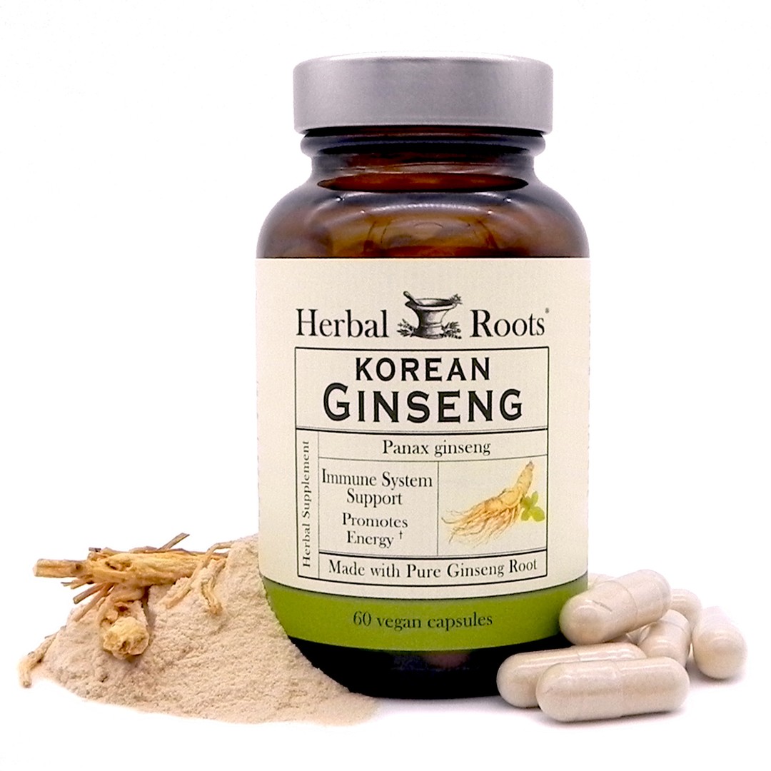 Bottle of Herbal Roots Korean Ginseng. To the right of the bottle are capsules and to the left is a small pile of powder with some small pieces of ginseng root