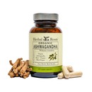 Bottle of Herbal roots Organic Ashwagandha with capsules on the right and ashwagandha root on the left