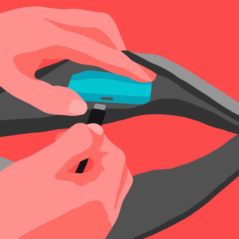 A hand plugging a USB cable into the charging port of a Bluetooth® sleep mask.