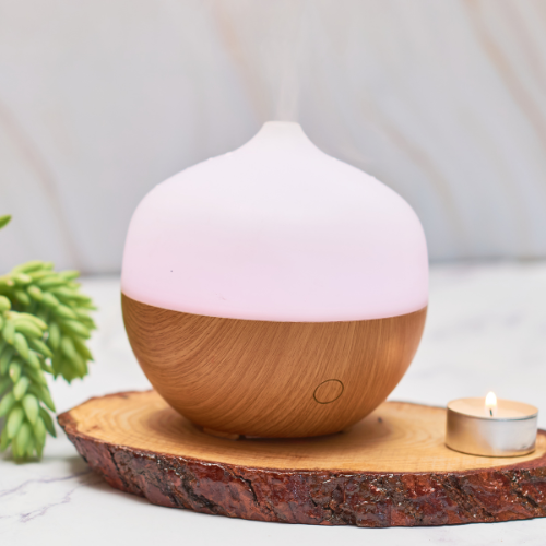 a pink and wooden aromatherapy diffuser.