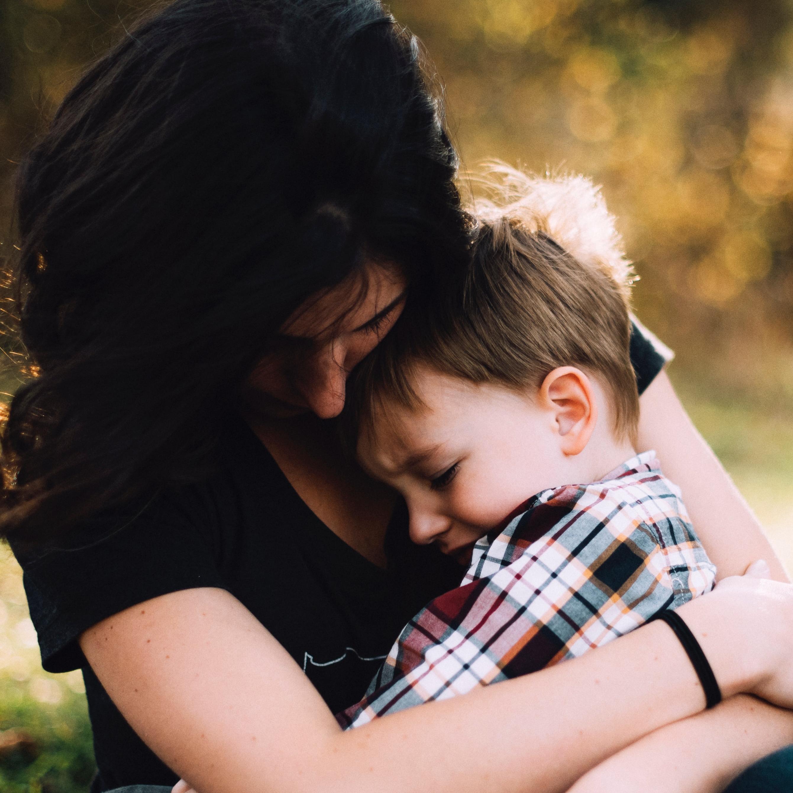 mother comforting son with anxiety