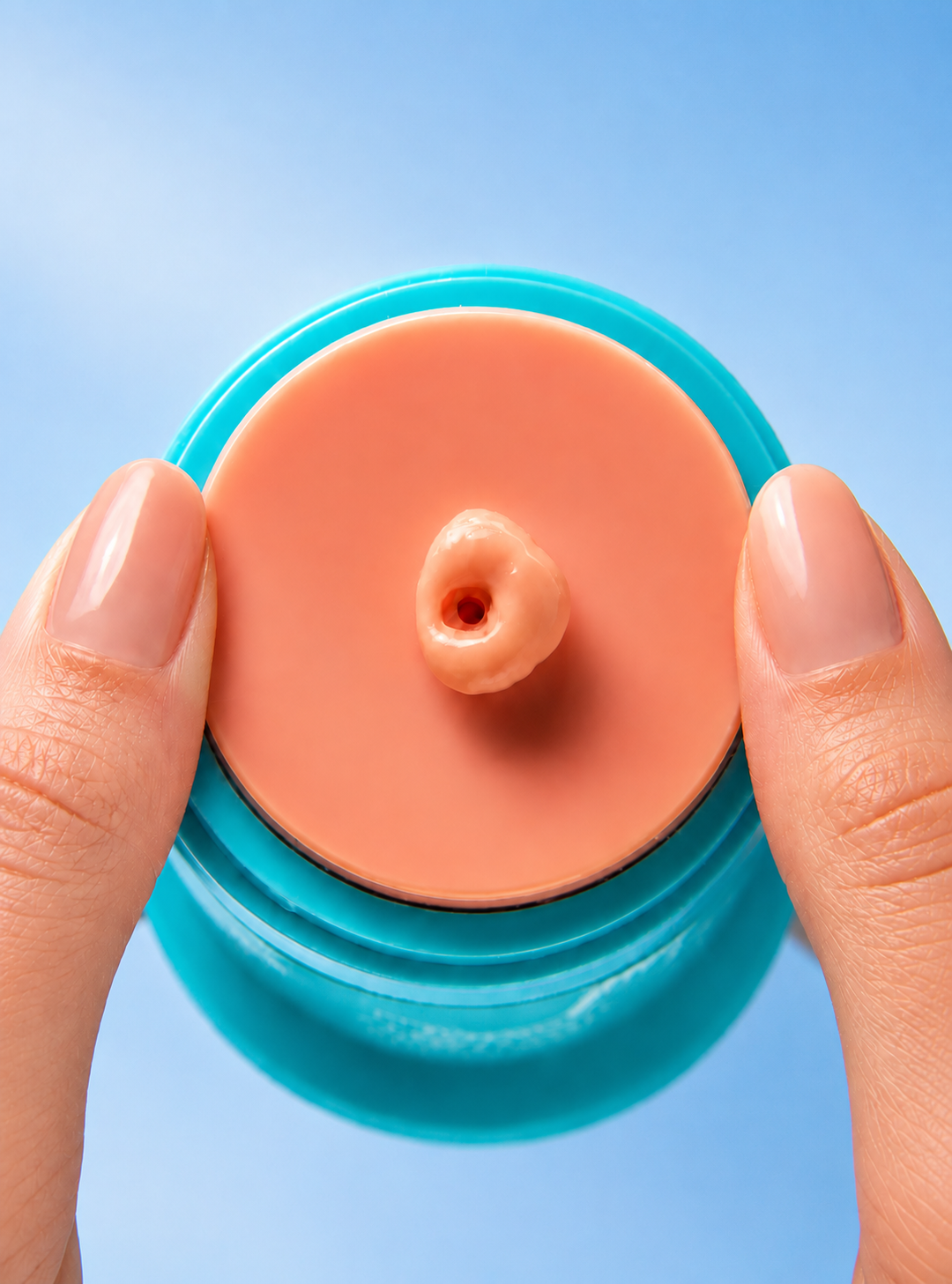 Press the sides of the circular airless pump.