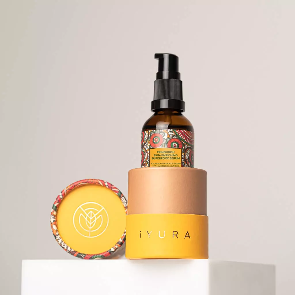 A bottle of Prinourish kept inside it's beautiful, vibrant packaging, on a white color platform