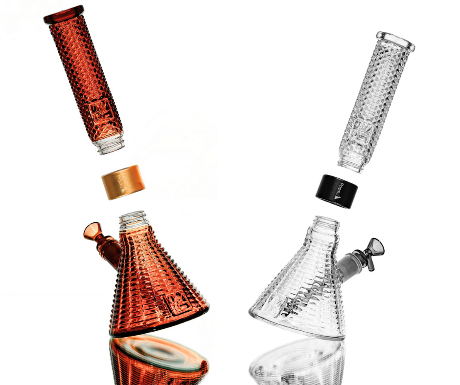 The Prism x Jane West Twenties MINI Beaker Bongs, in clear and amber textural glass, displayed disassembled against a clean white background. The image highlights the modularity, portability, and easy-clean functionality of the two-piece design, while emphasizing the unique gridded Art Deco pattern on all components.
