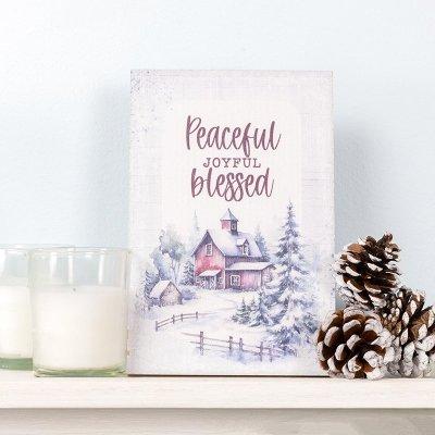 plaque with snowy scene and cozy cabin: Peaceful Joyful Blessed