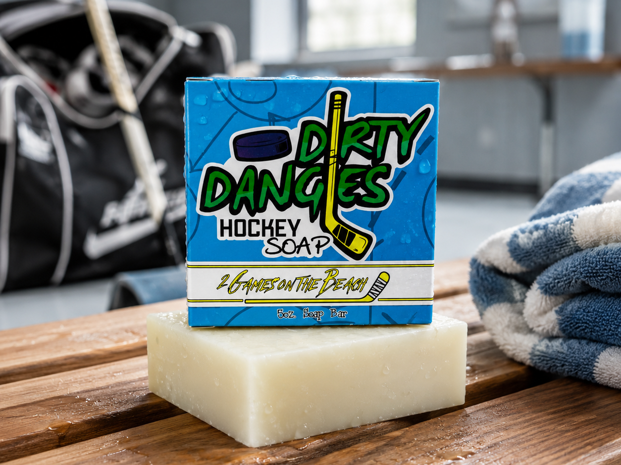 2 games on the beach hockey soap bar on a wooden bench inside a locker room with hockey gear in the background
