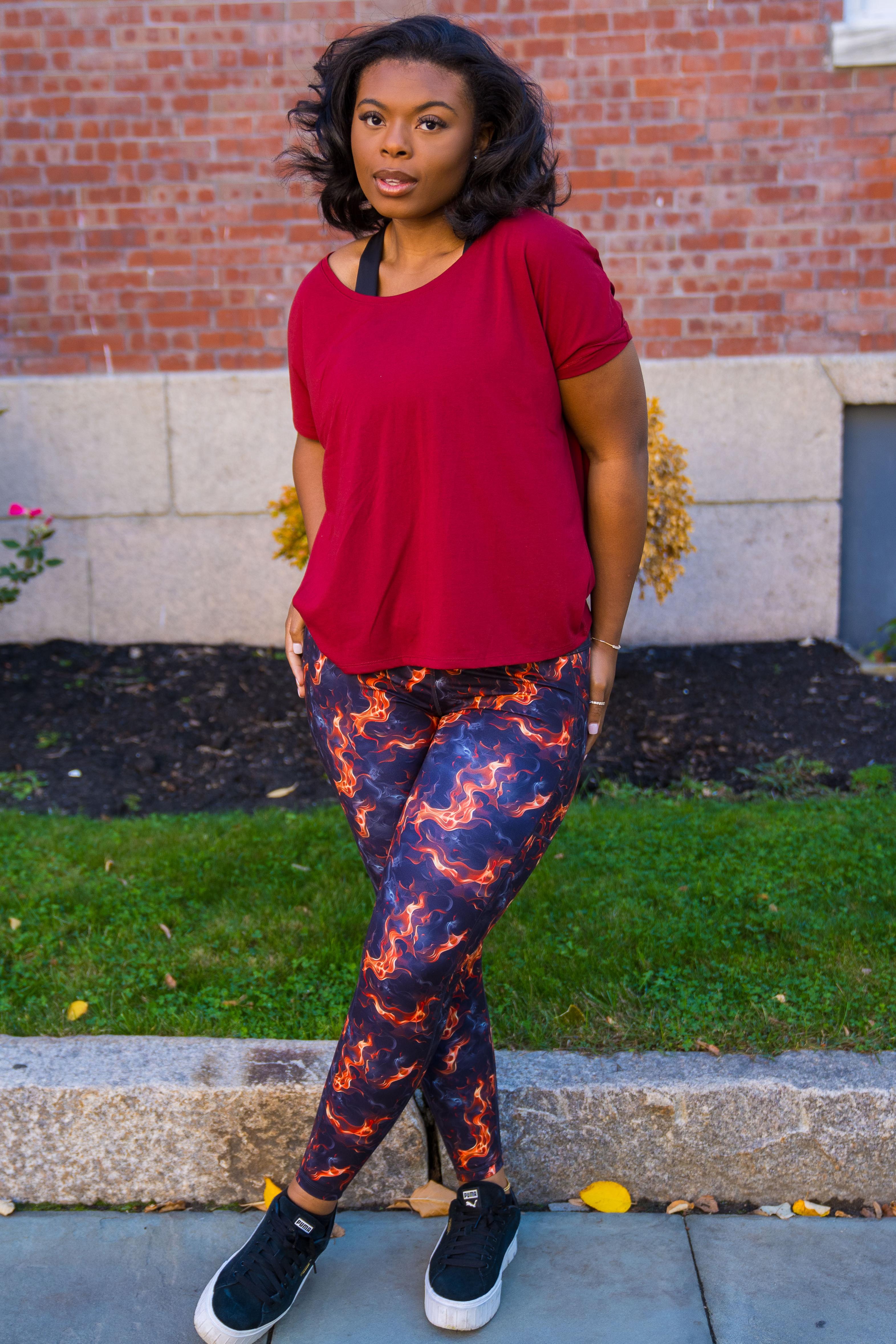 model wearing the paw print patterned shorts and sports bra