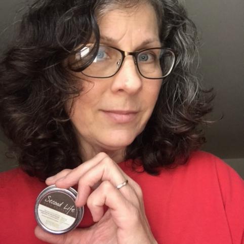 Laura holding Beesilk Lotion Bar for dry skin