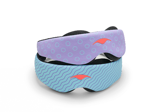 Two contoured sleep masks with eye cups piled on top of another.