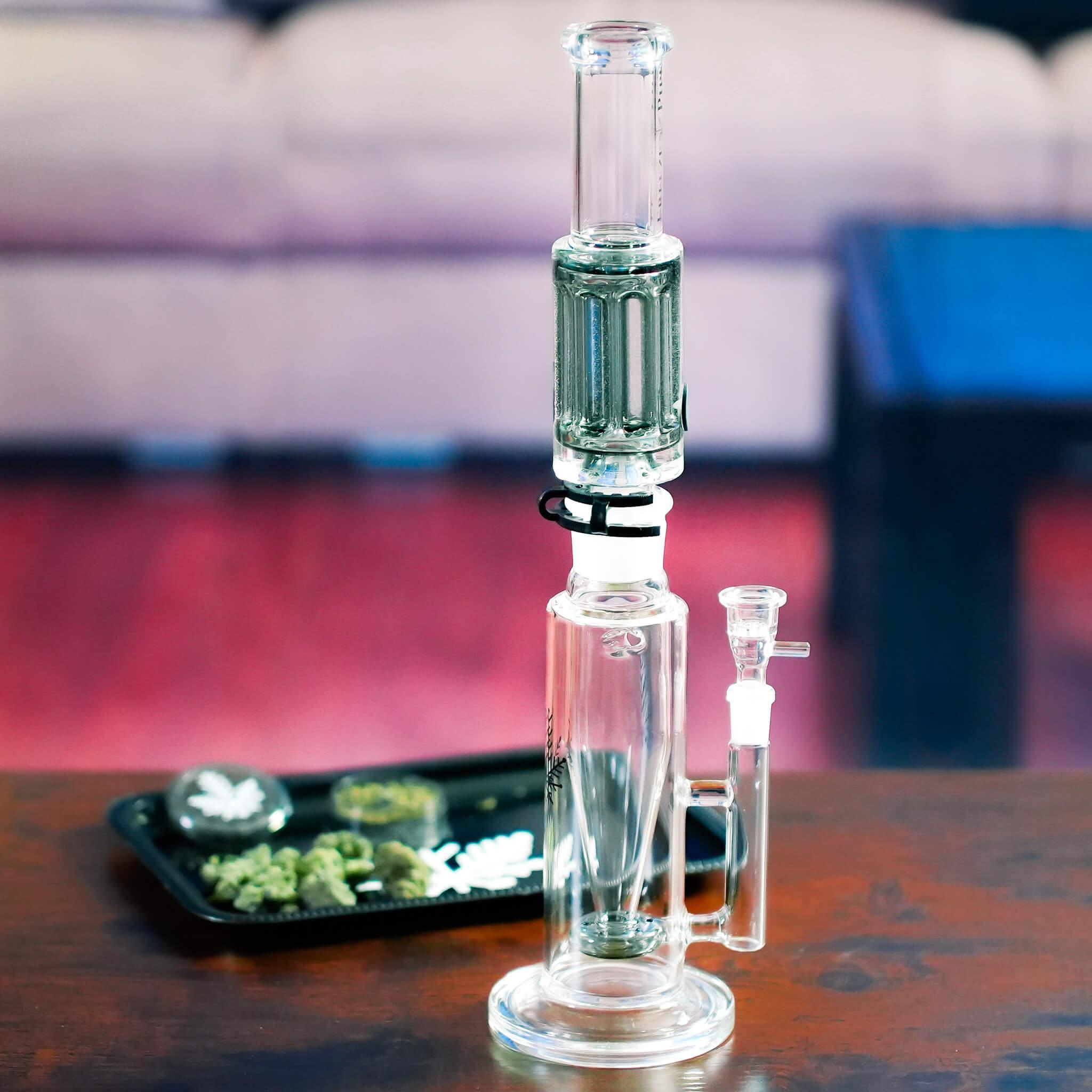 percolator bong on table with grinder and weed